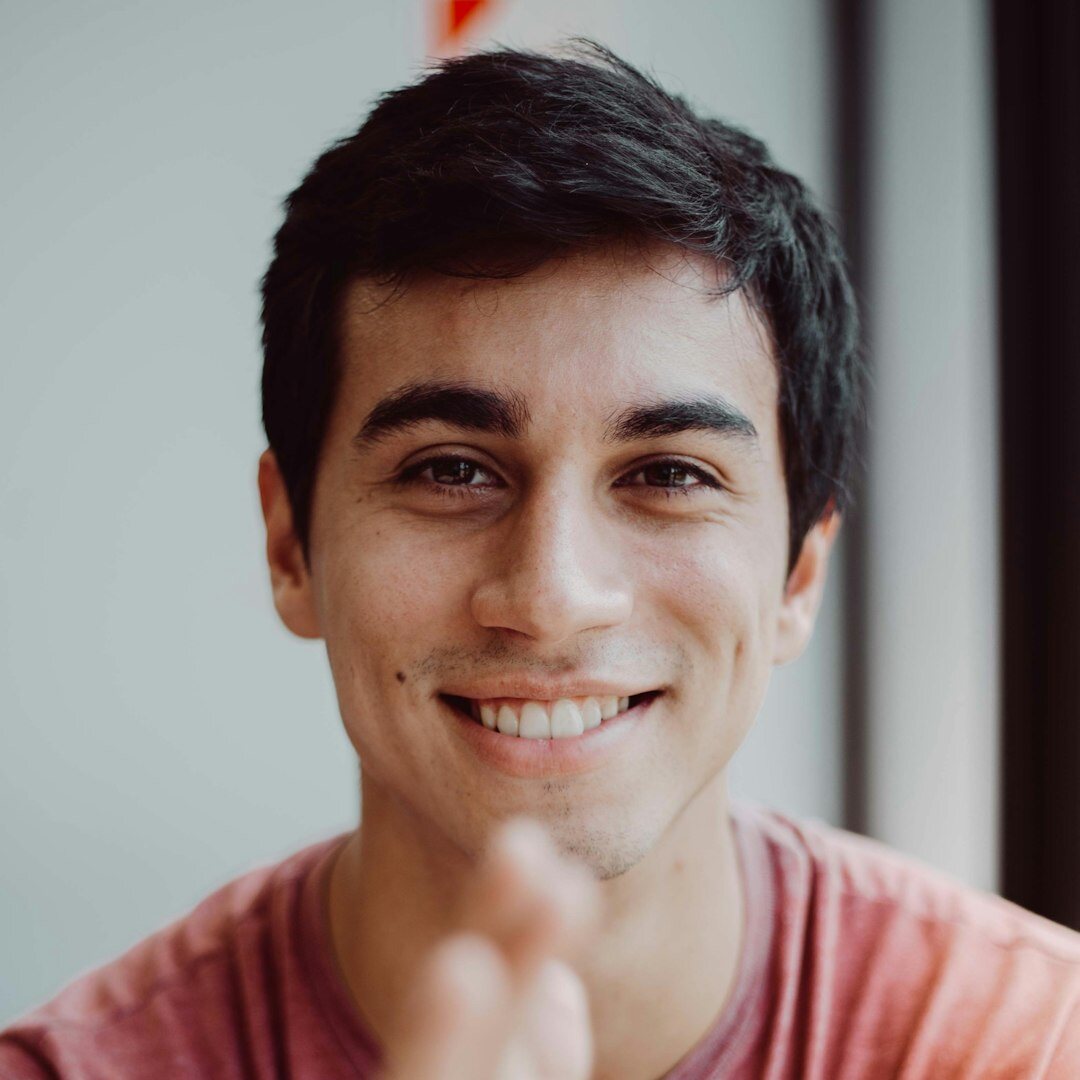 Happy male student who completed media course